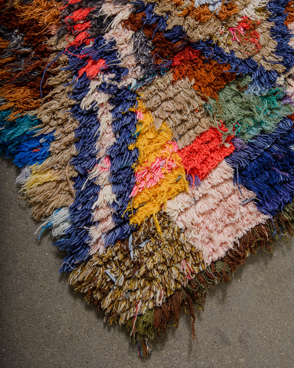 Multicolored textured rug on a neutral background
